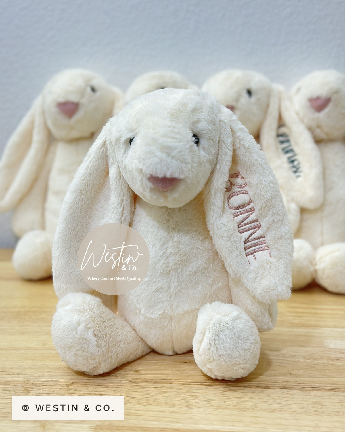 Personalized embroidered plush bunny in ivory with a name stitched on the ear